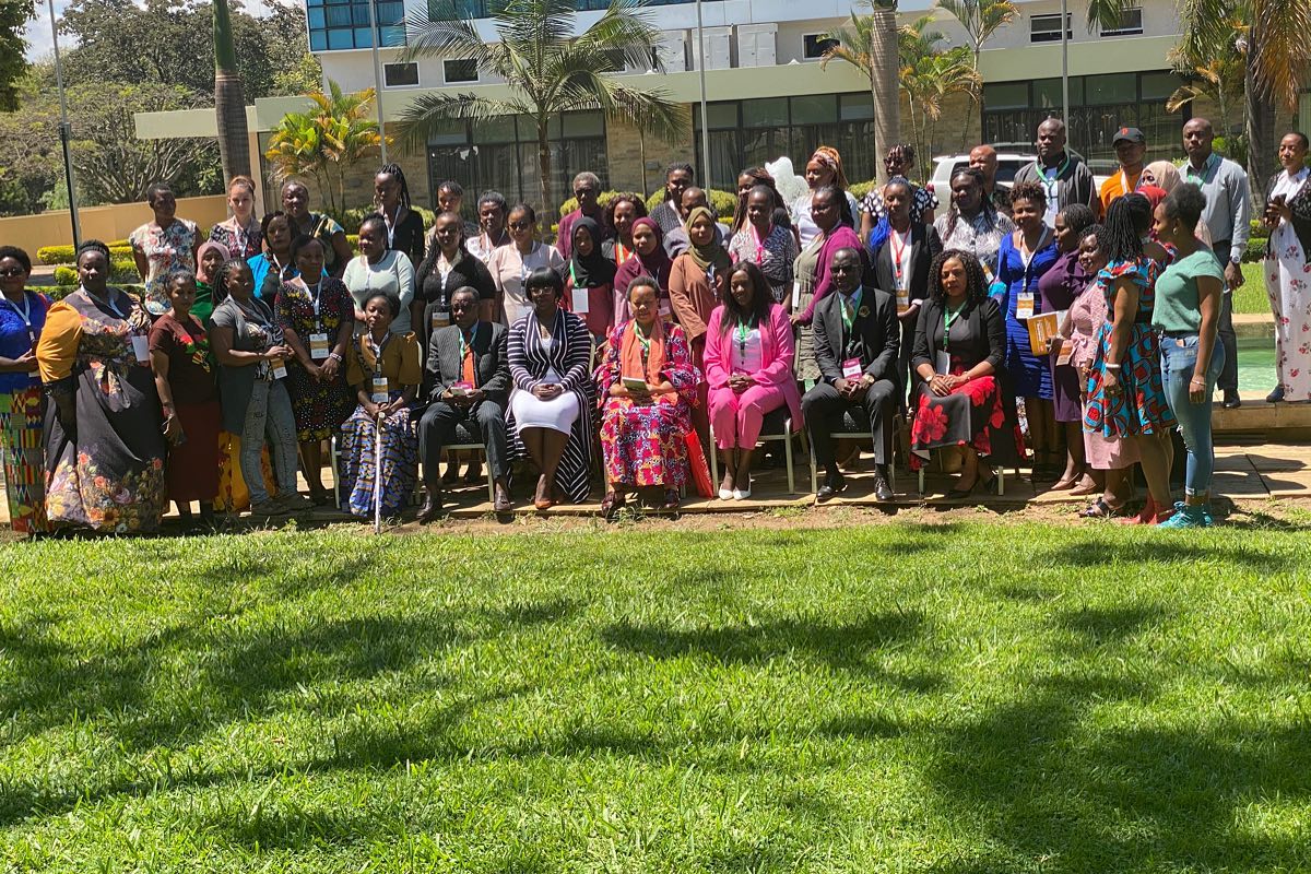 Delegates of the International Gathering of Female Champions gathered together on the lawn in Tanzania