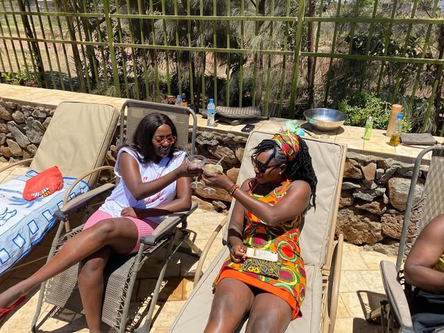 Delegates relaxing poolside during the Queens Retreat